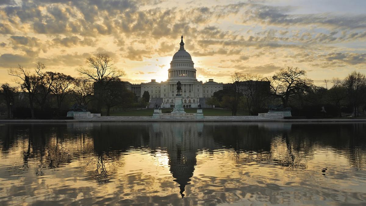 US Capitol Building with sunrise sky