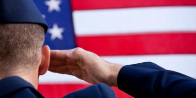 soldier saluting the US flag